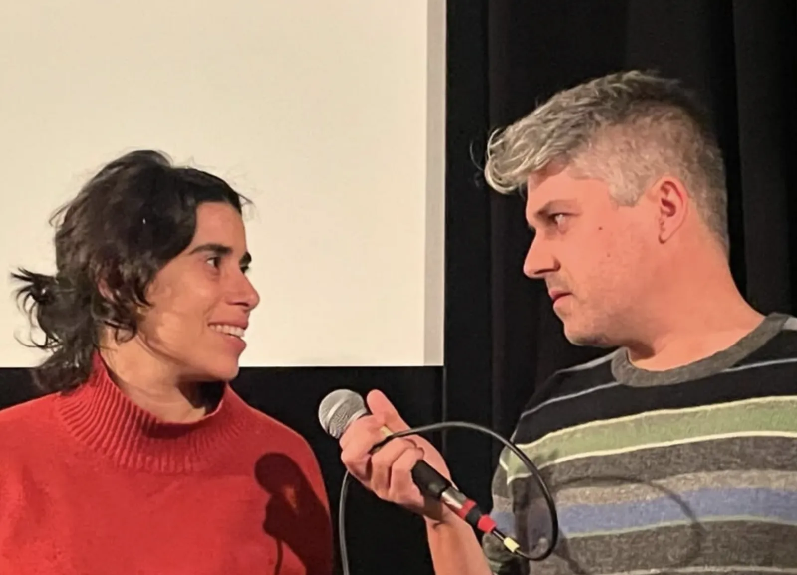 A filmmaker answers a question from the audience