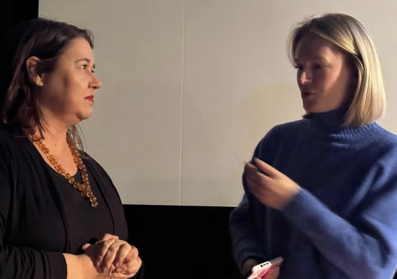 Two guests in conversation before the screening